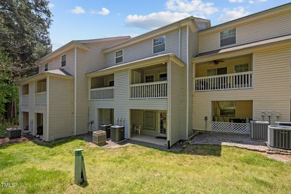 an aerial view of residential house with outdoor space and parking