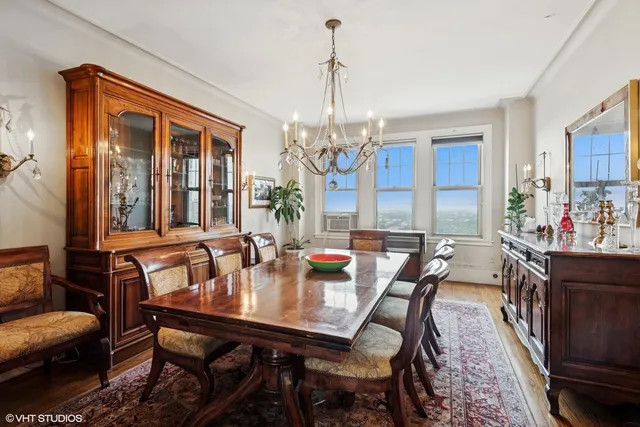 a view of a dining room with furniture window and outside view