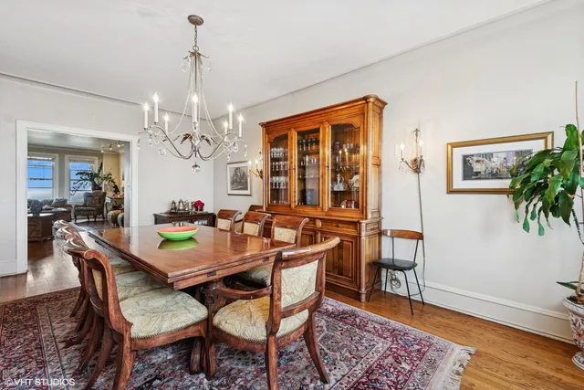 a view of a dining room with furniture and wooden floor