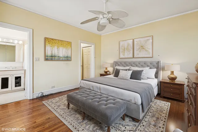 a bedroom with bed and wooden floor
