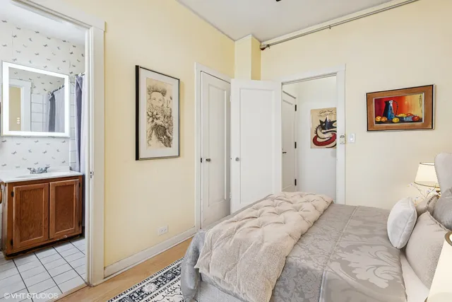 a bedroom with a bed and a view of bathroom