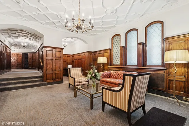 a view of hall way with furniture