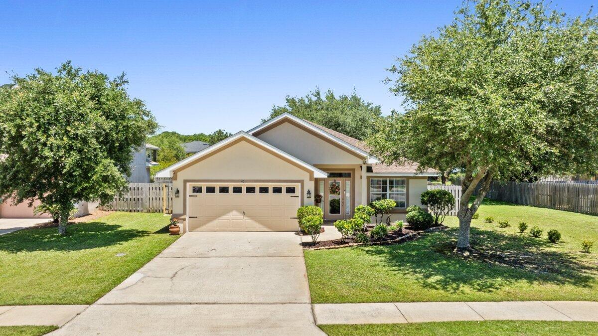 40 Red Bay Court Santa Rosa Beach, FL 32459 - Photo 1 of 49 a front view of a house with a yard