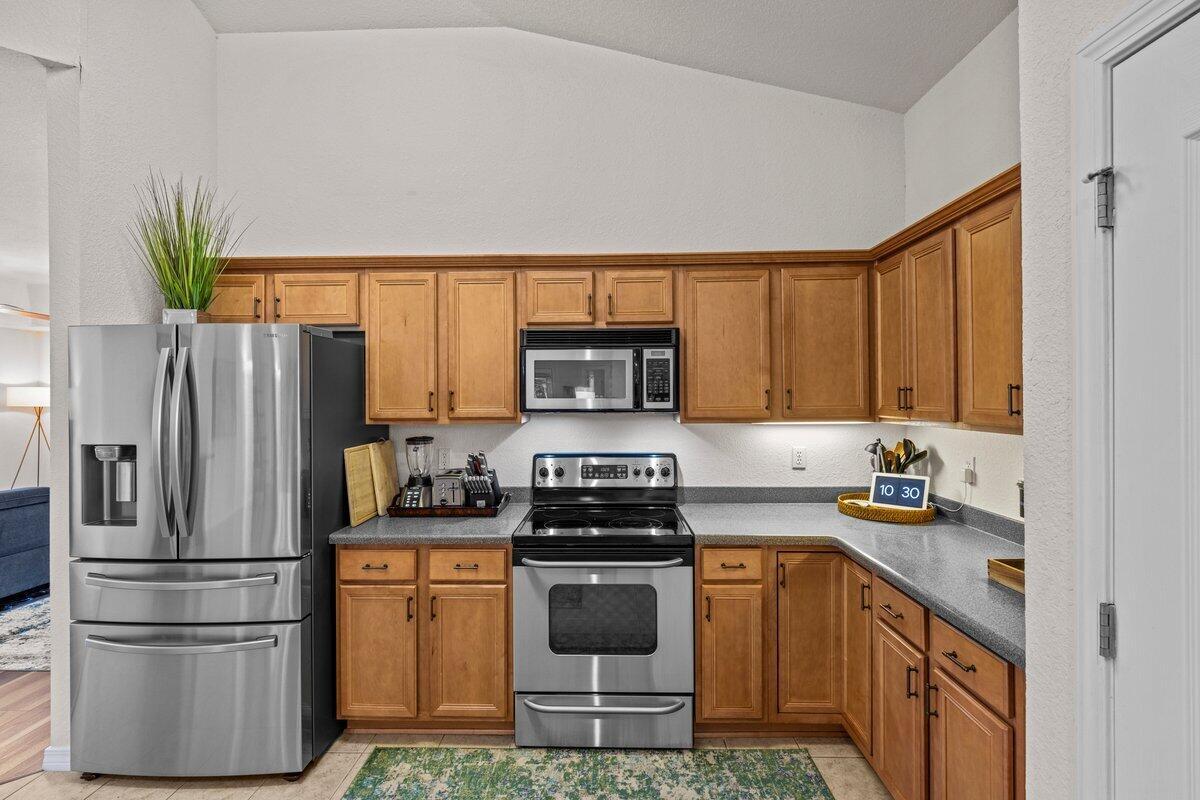 40 Red Bay Court Santa Rosa Beach, FL 32459 - Photo 11 of 49 a kitchen with a refrigerator a stove and a sink