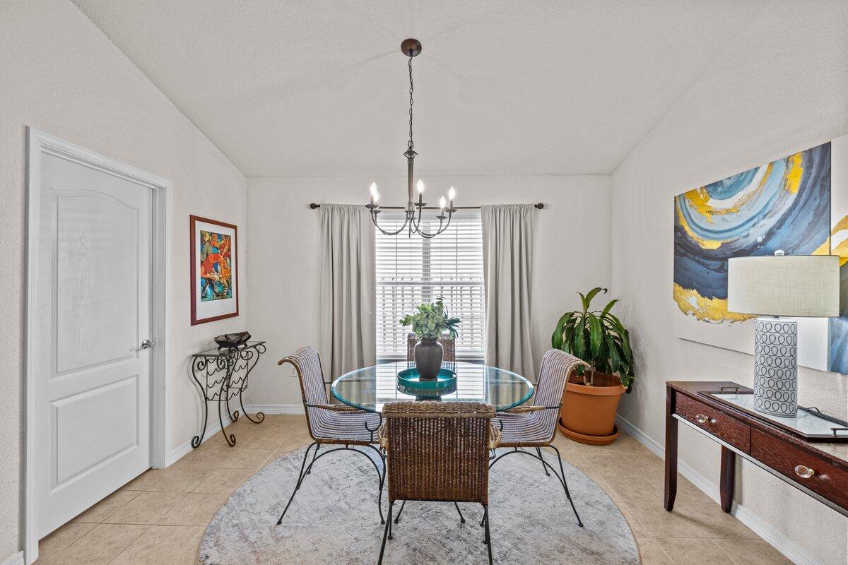 40 Red Bay Court Santa Rosa Beach, FL 32459 - Photo 13 of 49 a dining room with furniture a chandelier and window