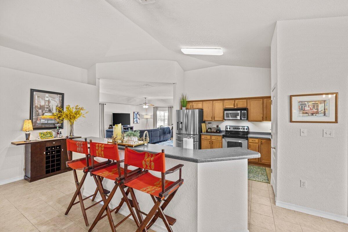 40 Red Bay Court Santa Rosa Beach, FL 32459 - Photo 15 of 49 a dining hall with stainless steel appliances a dining table and chairs