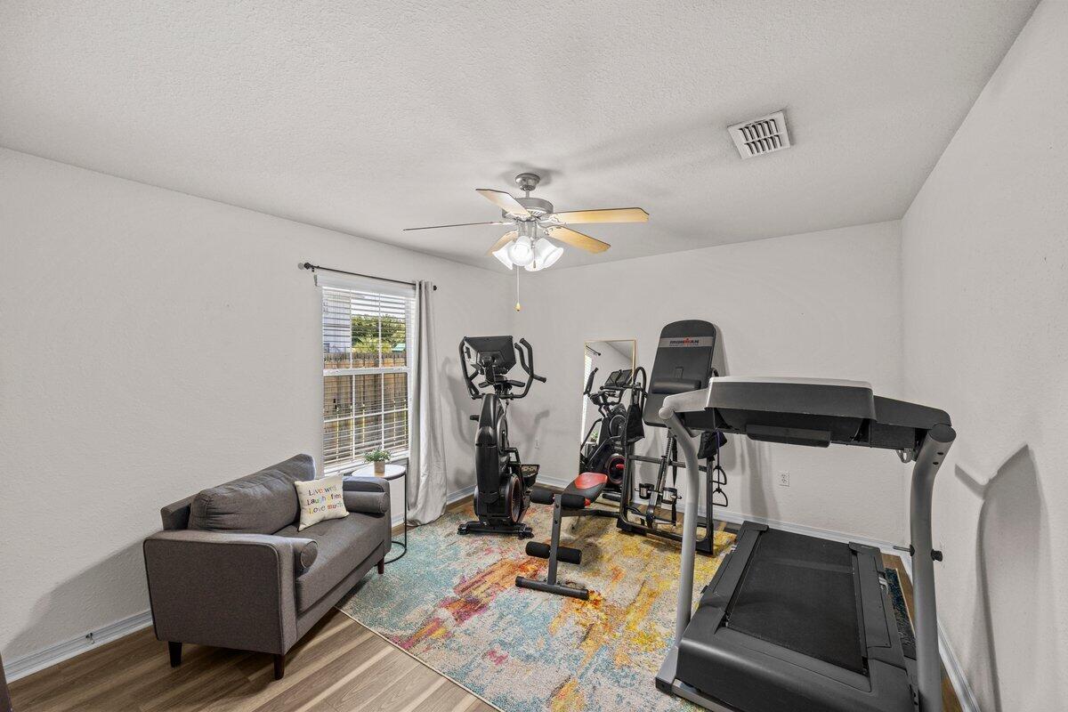40 Red Bay Court Santa Rosa Beach, FL 32459 - Photo 18 of 49 a living room with furniture a window and gym equipment