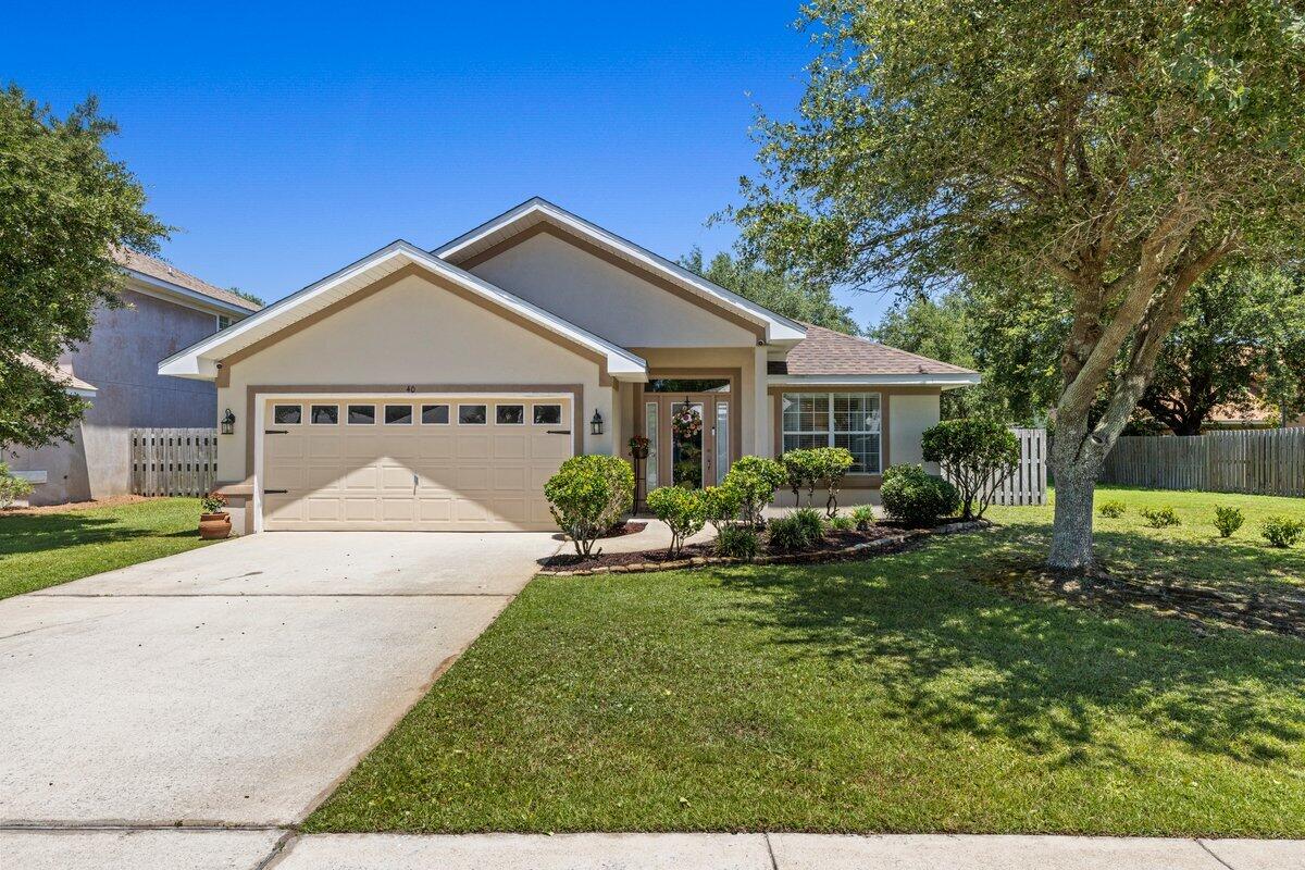 40 Red Bay Court Santa Rosa Beach, FL 32459 - Photo 2 of 49 a front view of a house with a yard