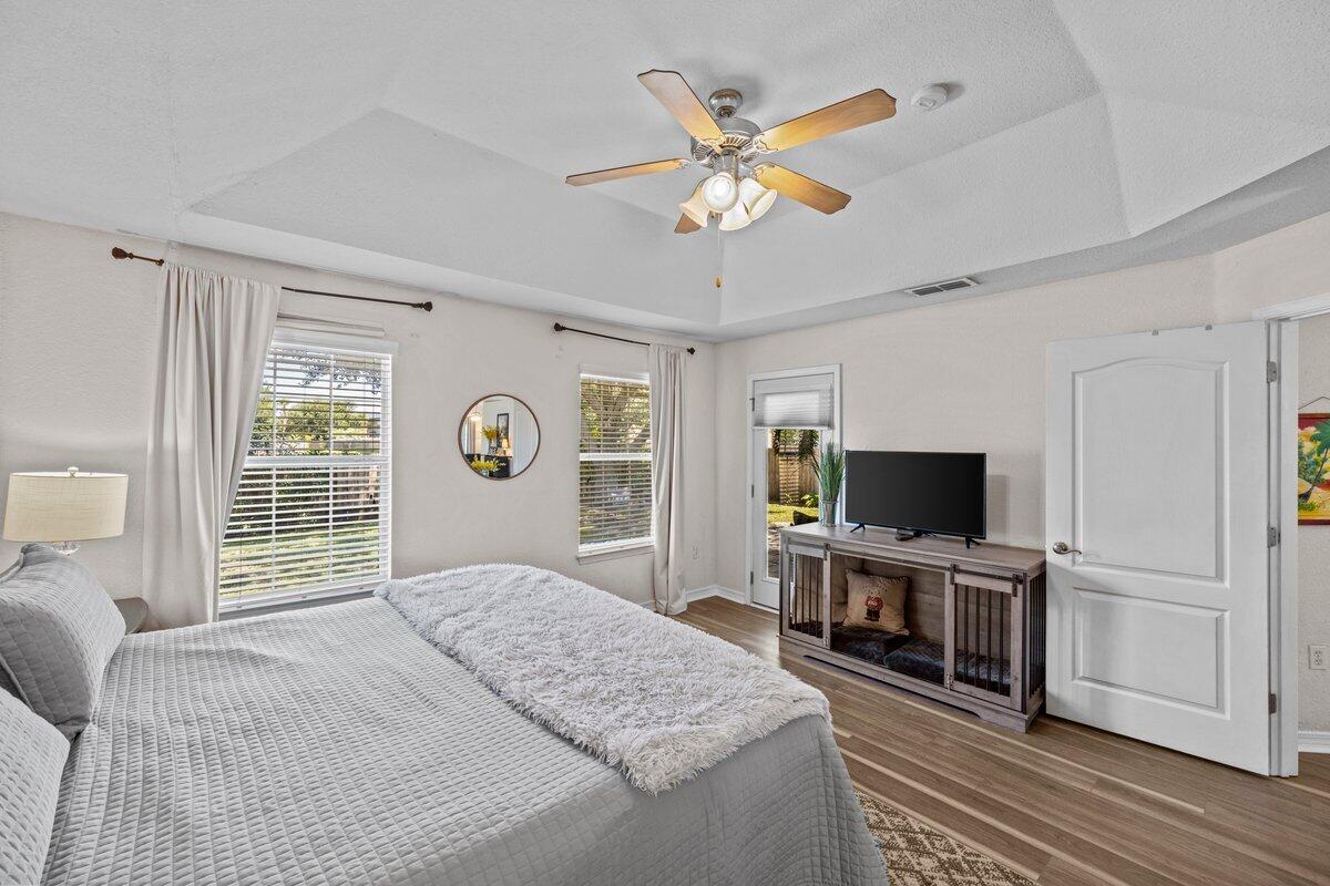 40 Red Bay Court Santa Rosa Beach, FL 32459 - Photo 25 of 49 a bedroom with a bed and a flat screen tv