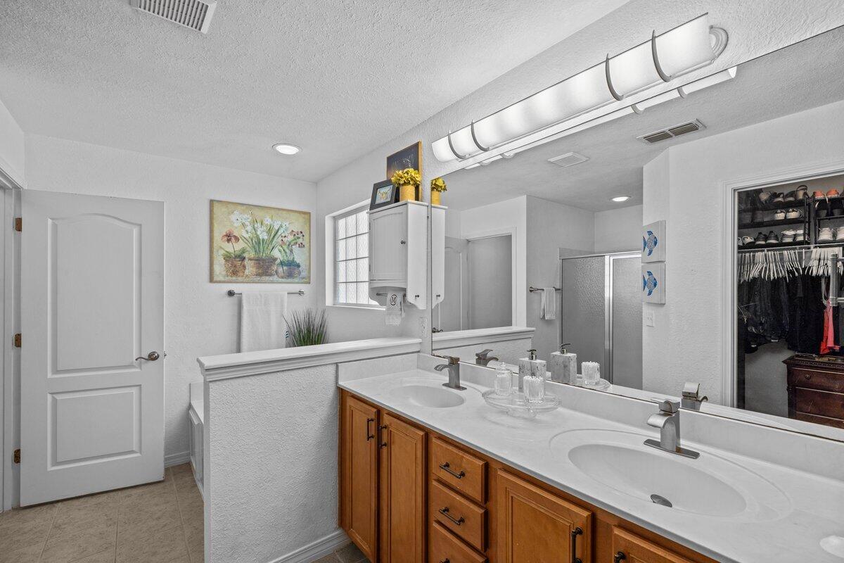 40 Red Bay Court Santa Rosa Beach, FL 32459 - Photo 26 of 49 a bathroom with a sink double vanity granite and a mirror