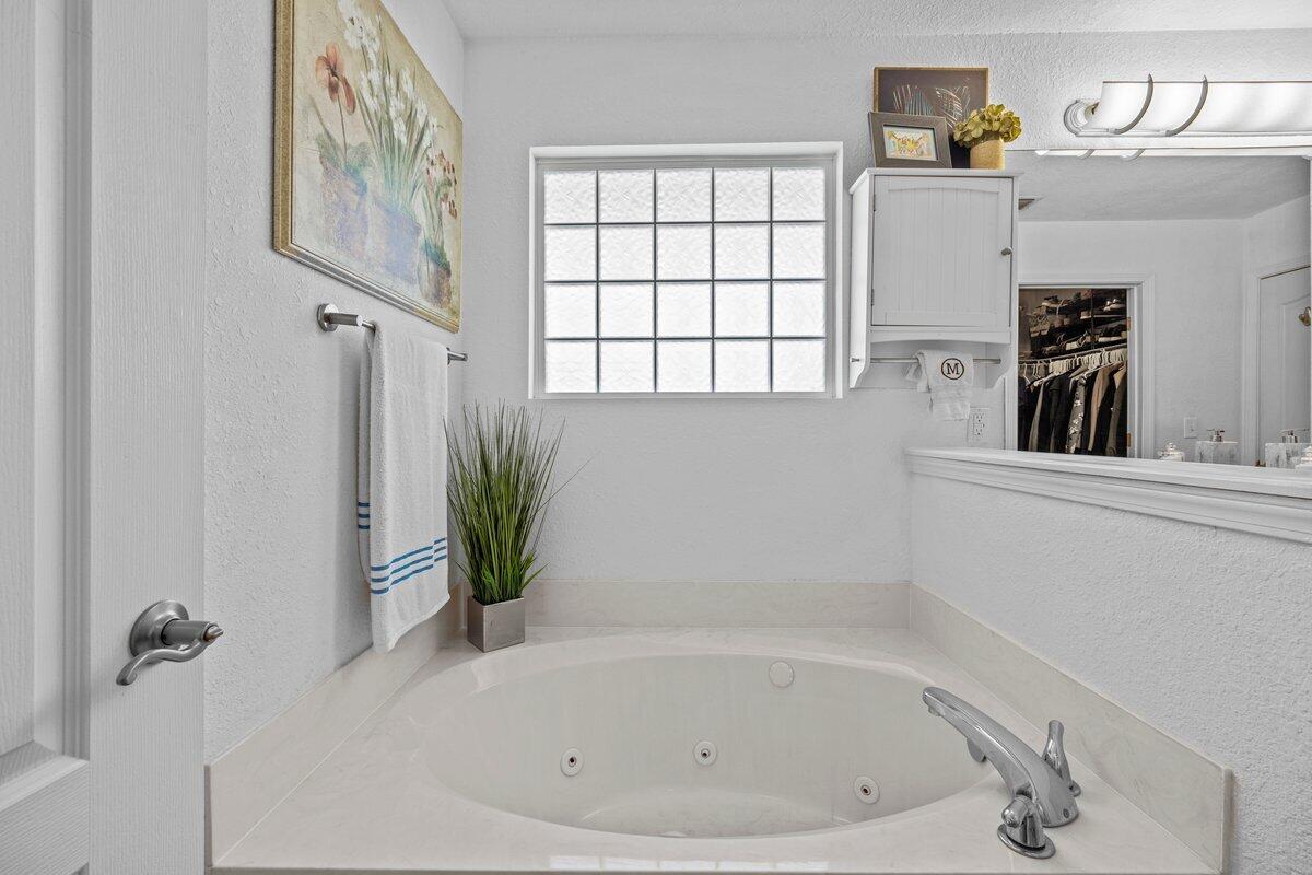 40 Red Bay Court Santa Rosa Beach, FL 32459 - Photo 27 of 49 a white bath tub sitting next to a window