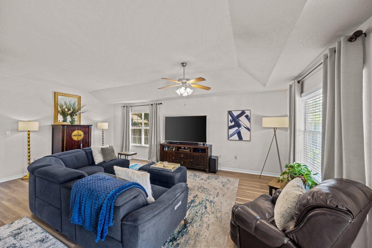 40 Red Bay Court Santa Rosa Beach, FL 32459 - Photo 5 of 49 a living room with furniture and a flat screen tv