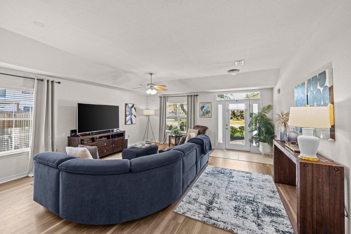 40 Red Bay Court Santa Rosa Beach, FL 32459 - Photo 6 of 49 a living room with furniture and a flat screen tv