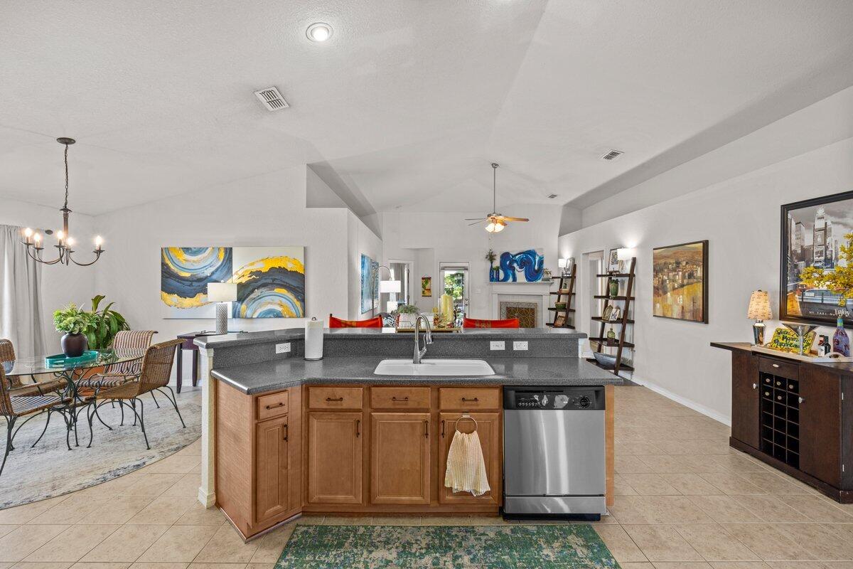 40 Red Bay Court Santa Rosa Beach, FL 32459 - Photo 9 of 49 a kitchen with stainless steel appliances granite countertop a stove and cabinets