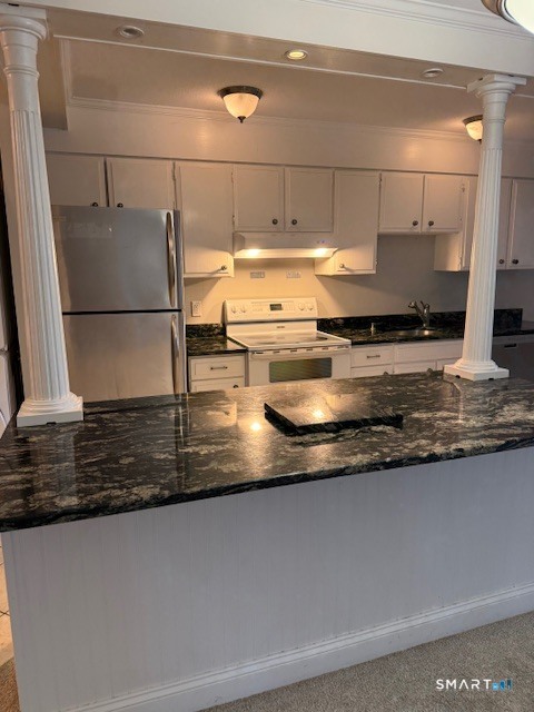 85 River Road, Unit M4 Essex, CT 06426 - Photo 2 of 2 The kitchen was remodeled to include stainless appliances, granite countertops and a large island counter space.