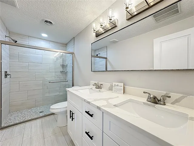 a bedroom with two beds and a window