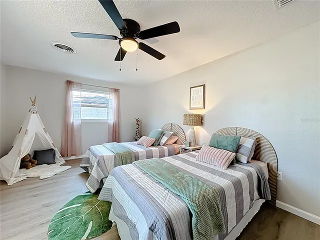 a bed room with bed and window