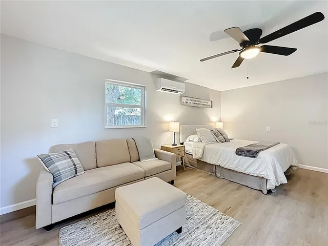 a bathroom with a toilet a sink a shower and mirror