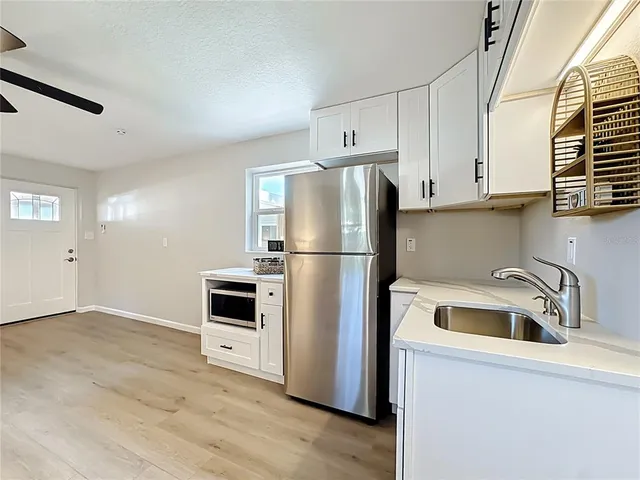 a bathroom with a sink a vanity and a mirror