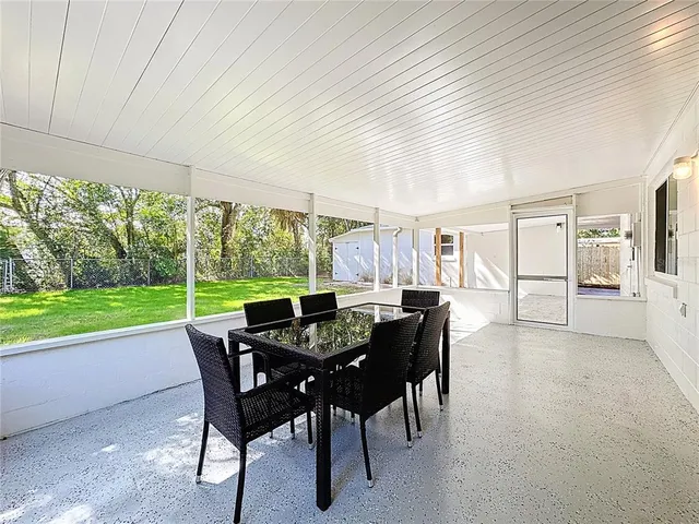 a view of a house with porch and garden