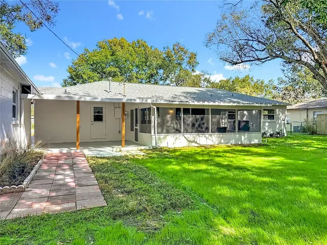 an aerial view of residential houses with city view