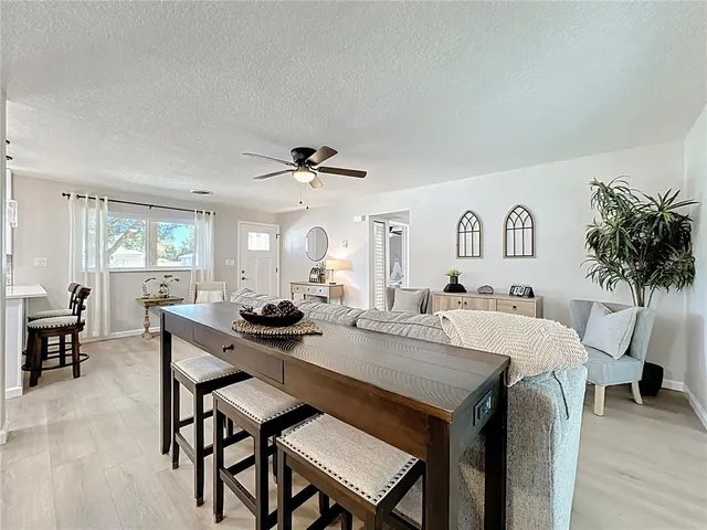 a dining room with furniture and window