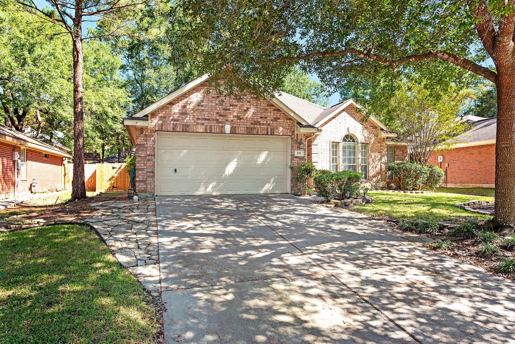 135 West Russet Grove Circle The Woodlands, TX 77384 - Photo 1 of 31 a view of a house with a yard