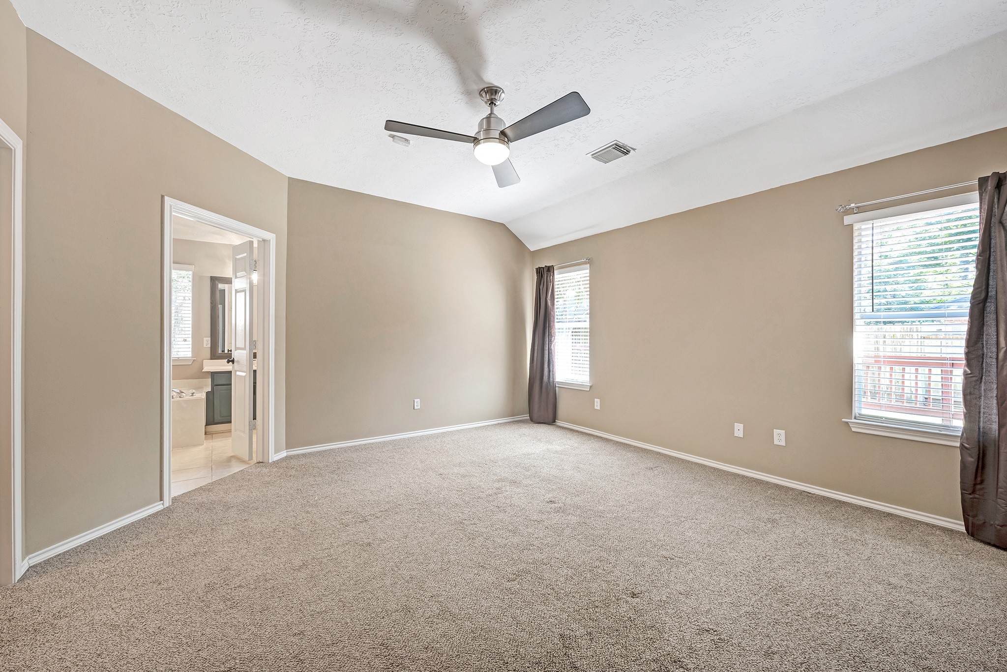 135 West Russet Grove Circle The Woodlands, TX 77384 - Photo 22 of 31 a view of an empty room with a window