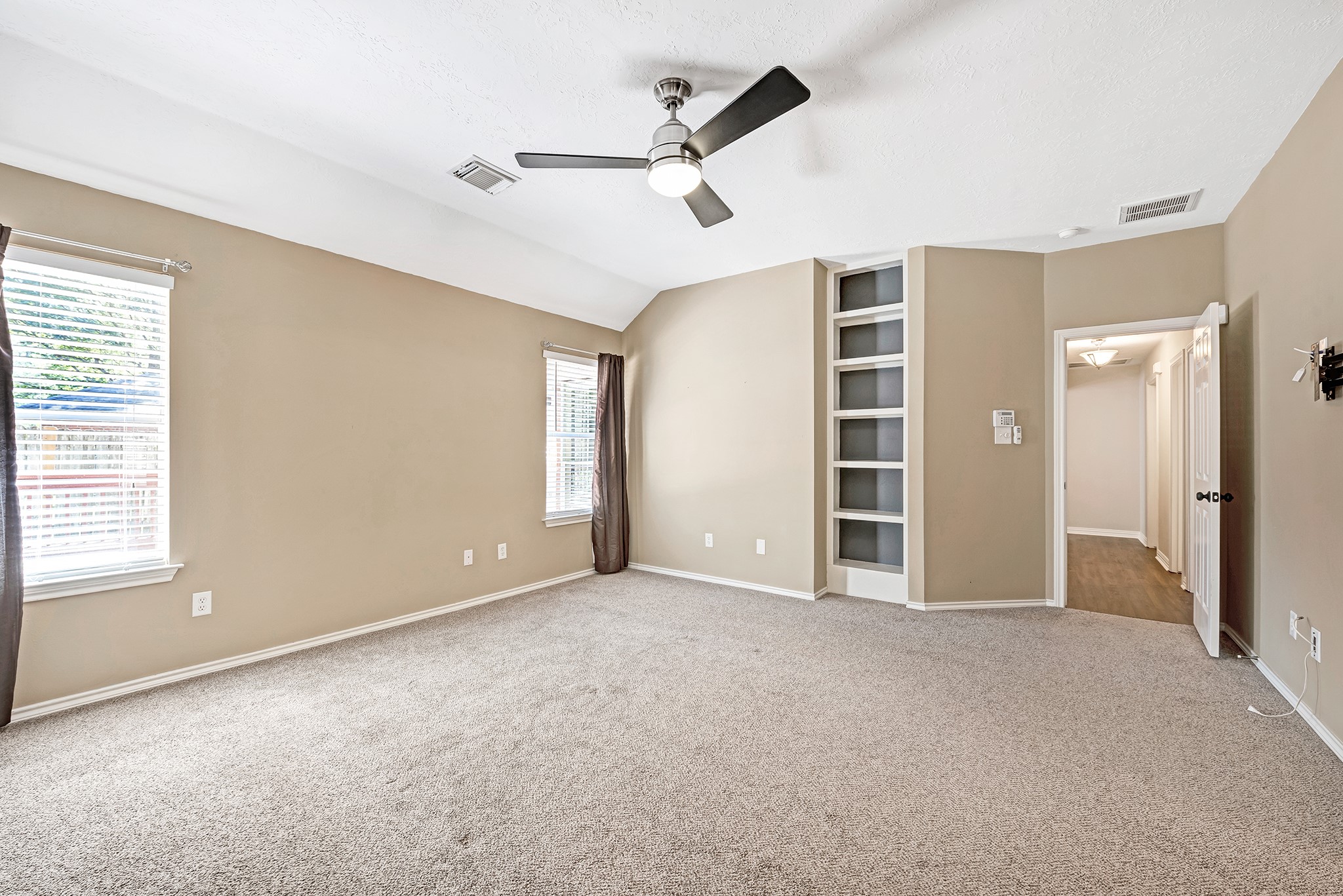135 West Russet Grove Circle The Woodlands, TX 77384 - Photo 23 of 31 a view of an empty room with a window