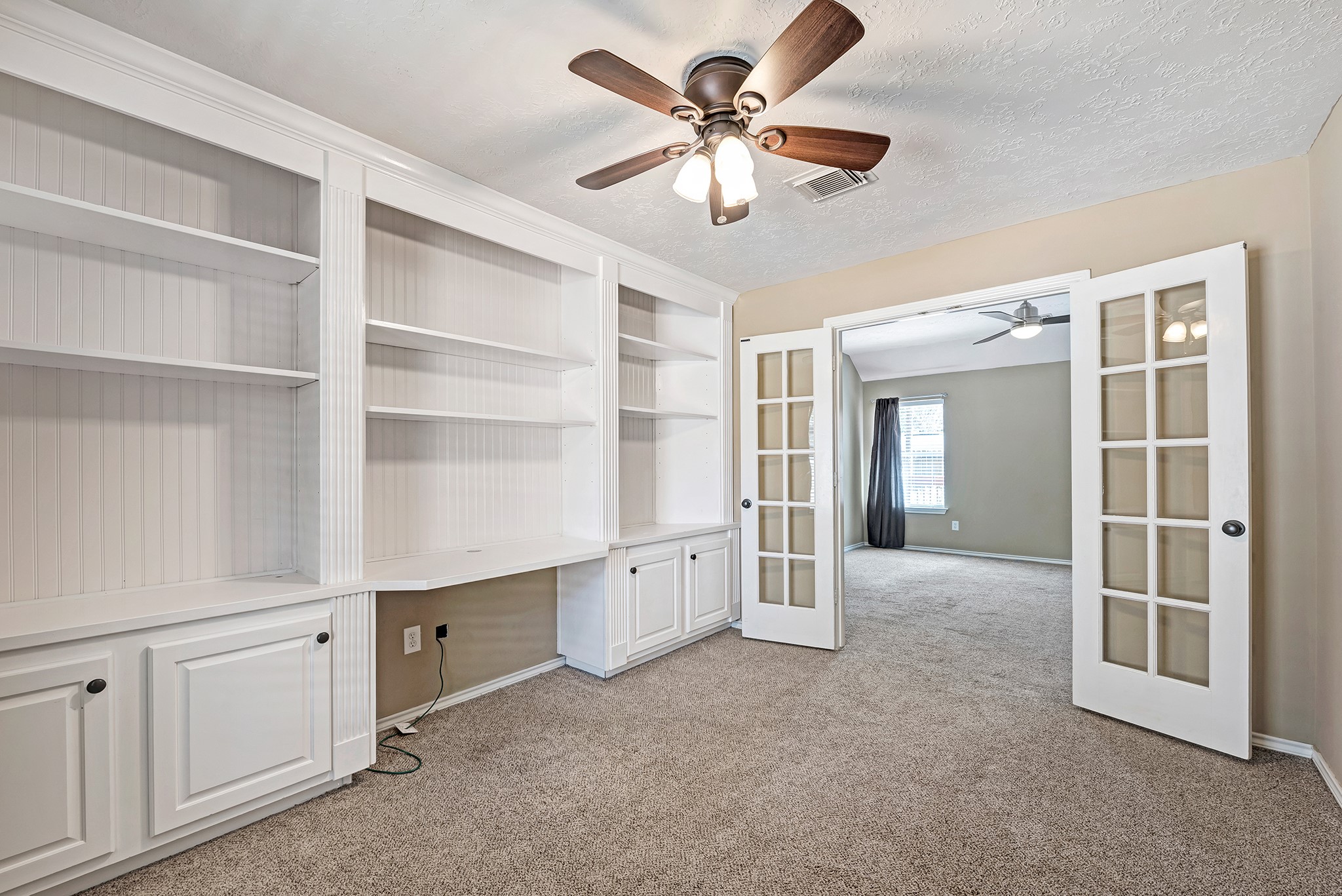 135 West Russet Grove Circle The Woodlands, TX 77384 - Photo 25 of 31 a view of an empty room with a window