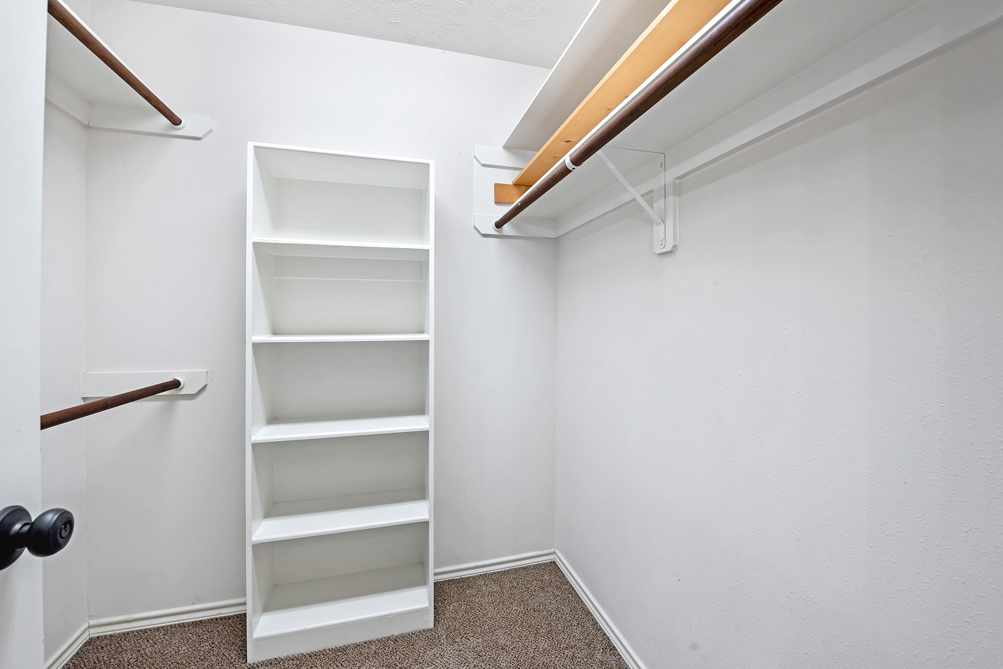 135 West Russet Grove Circle The Woodlands, TX 77384 - Photo 28 of 31 a view of walk in closet with empty racks