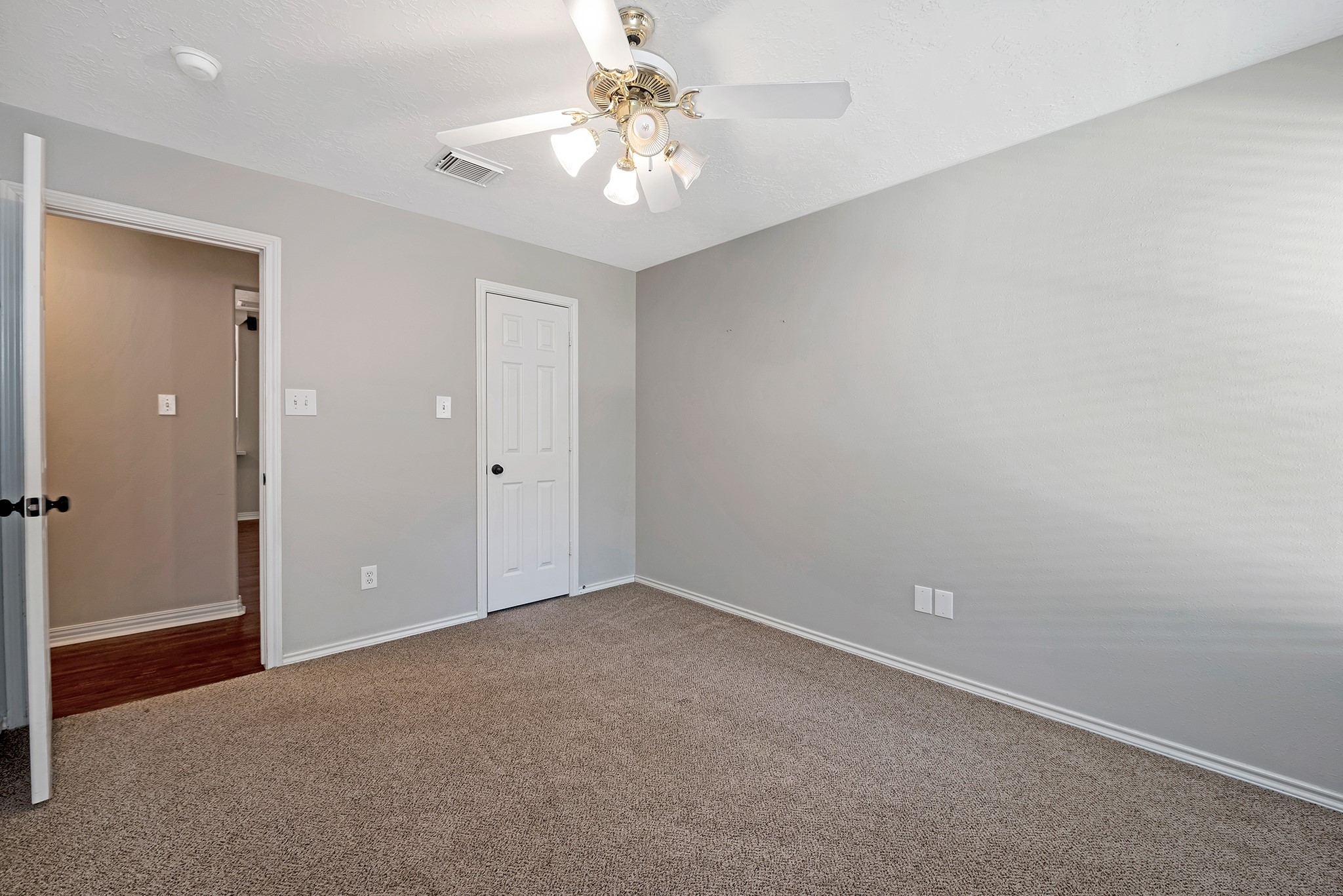 135 West Russet Grove Circle The Woodlands, TX 77384 - Photo 31 of 31 wooden floor in an empty room with a window