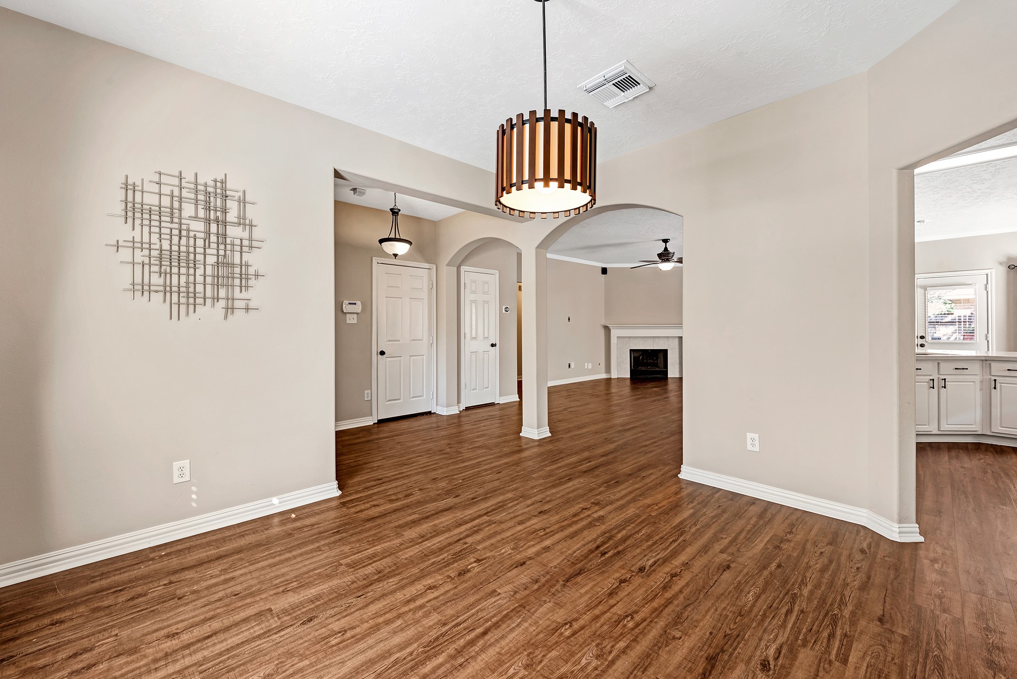 135 West Russet Grove Circle The Woodlands, TX 77384 - Photo 9 of 31 a view of an empty room with window and wooden floor