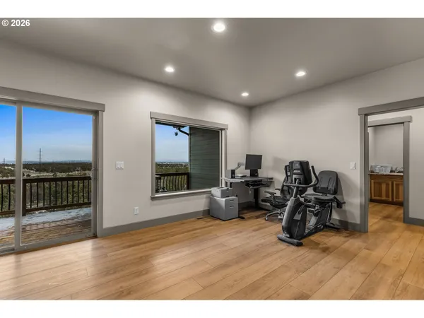 a living room with furniture window and a wooden floor