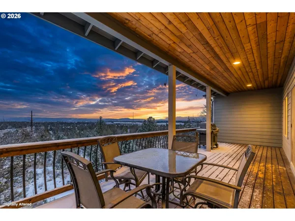 a view of a balcony with wooden floor