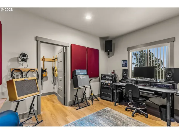 a workspace with furniture and a flat screen tv