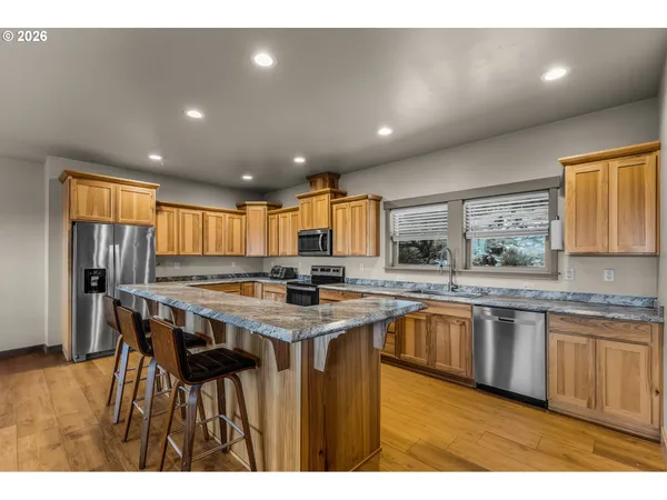 a kitchen with a table and chairs in it