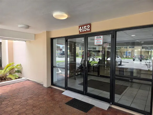 a view of a house with a yard and garage