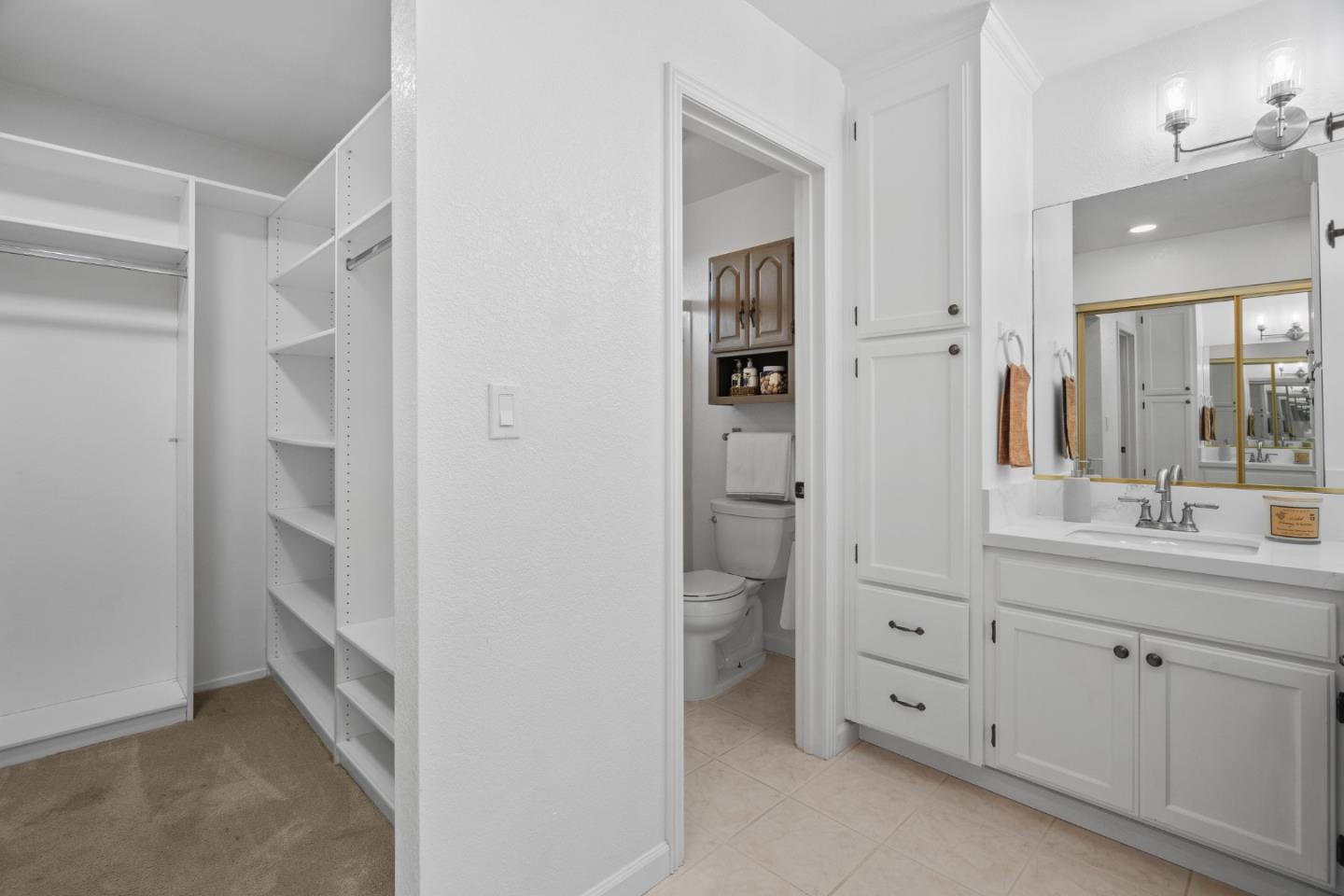 3585 Surry Place Fremont, CA 94536 - Photo 20 of 47 a bathroom with a double vanity sink a mirror and a toilet