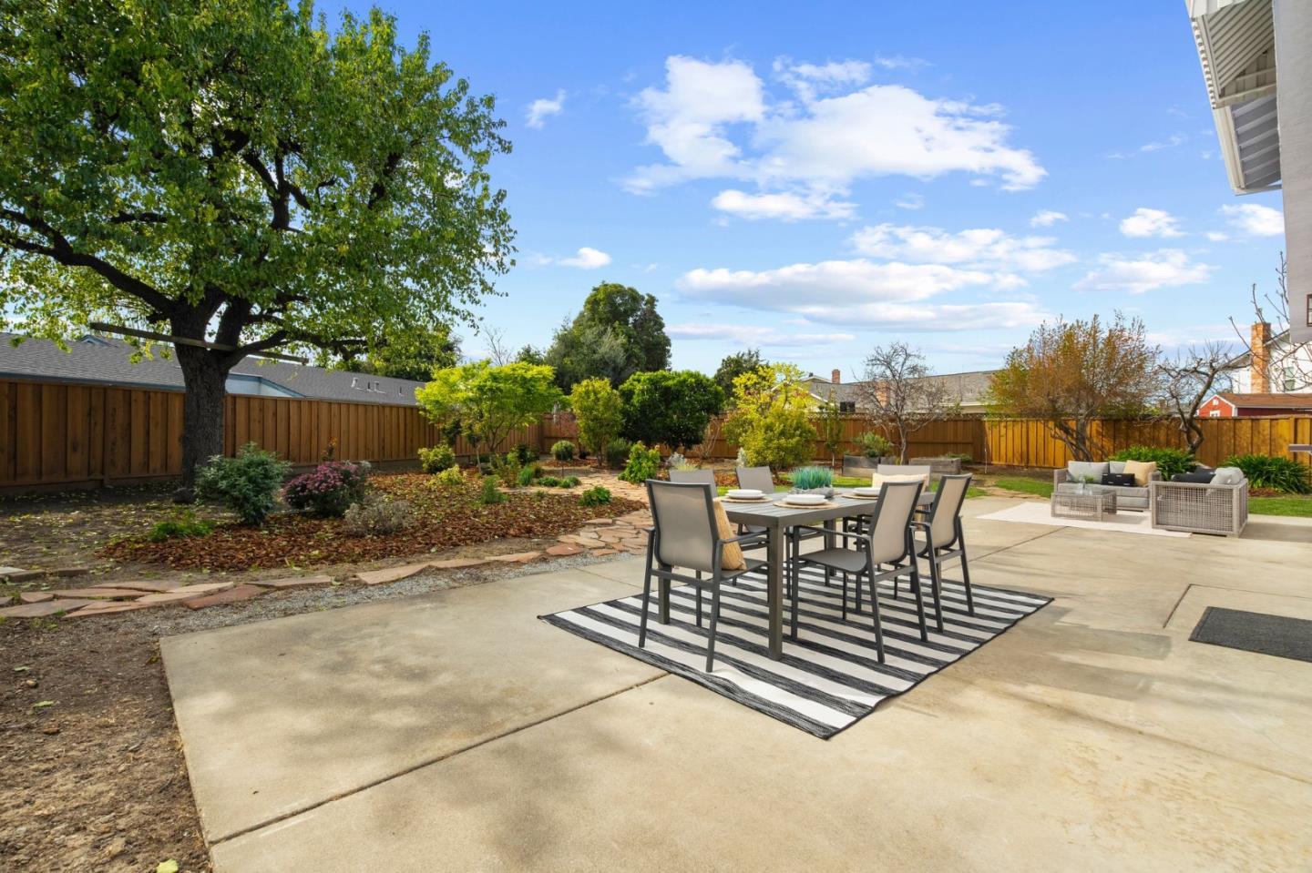 3585 Surry Place Fremont, CA 94536 - Photo 35 of 47 a view of a patio with a table and chairs with wooden fence