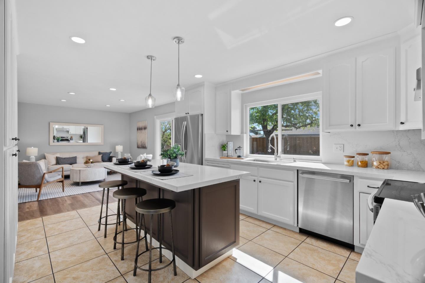 3585 Surry Place Fremont, CA 94536 - Photo 8 of 47 a kitchen with stainless steel appliances granite countertop a sink a stove a refrigerator and island with wooden floor