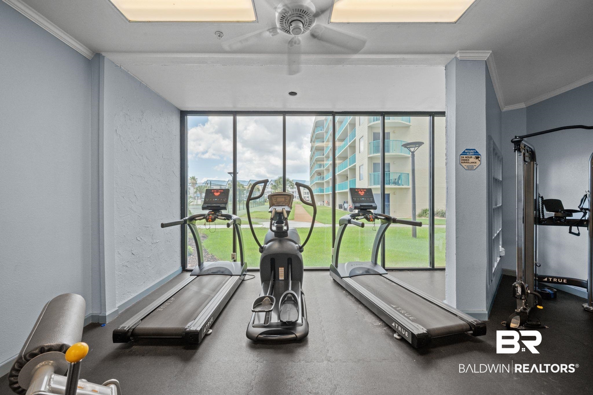 375 Plantation Road, Unit 5304 Gulf Shores, AL 36542 - Photo 25 of 42 Gym with ornamental molding, a ceiling fan, and a textured wall