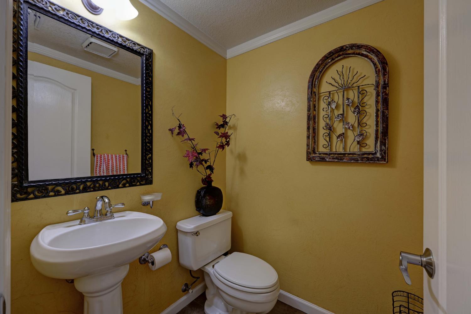 8801 Villa Campo Way Fair Oaks, CA 95628 - Photo 14 of 64 Half bath across from butlers pantry.