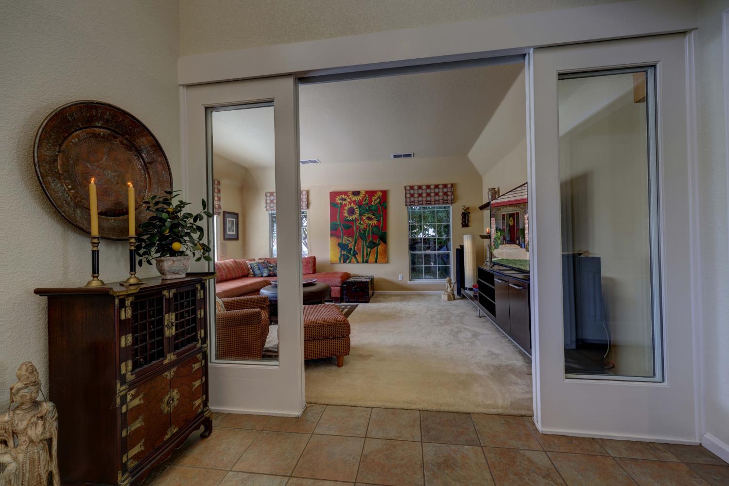8801 Villa Campo Way Fair Oaks, CA 95628 - Photo 7 of 64 To the left of the front door is the formal living room with sliding glass doors for privacy if needed.