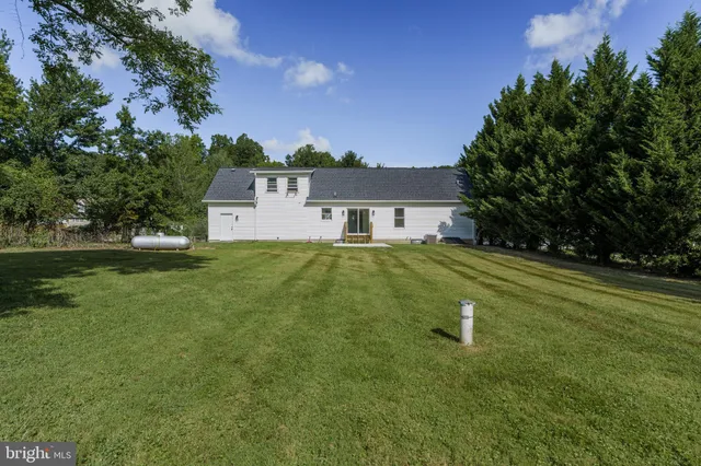 a view of a house with a big yard