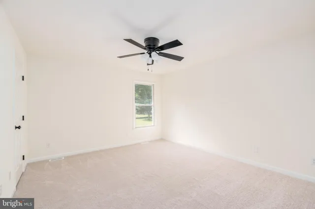 a view of a window in an empty room