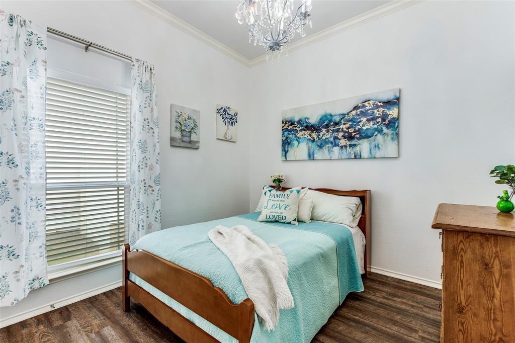 1712 Jasmine Trail Savannah, TX 76227 - Photo 12 of 21 a bedroom with a bed and a window