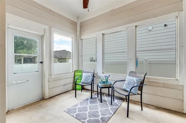 a living room with furniture and a window