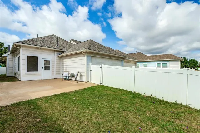 a front view of a house with yard and garage