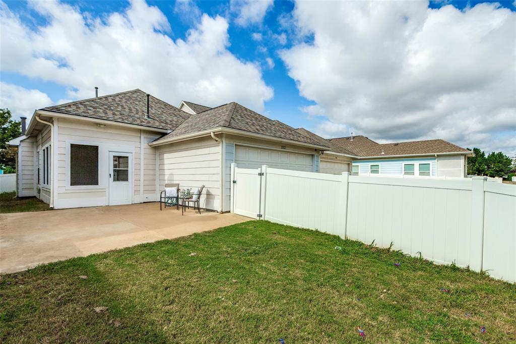 1712 Jasmine Trail Savannah, TX 76227 - Photo 17 of 21 a front view of a house with yard and garage